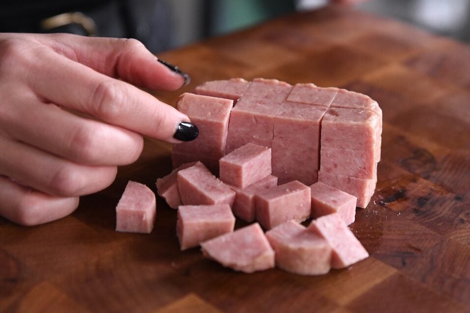 cubed spam on cutting board