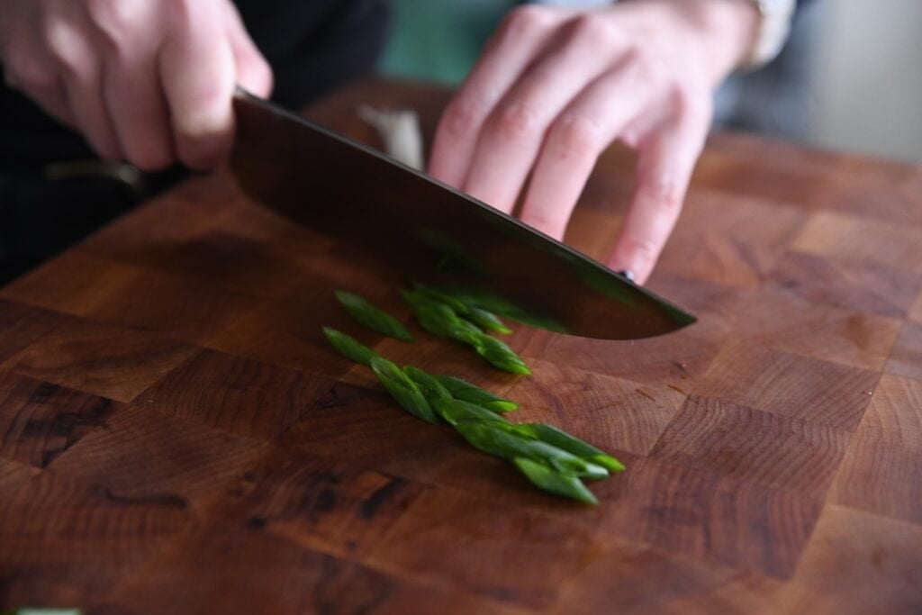 cutting green onion at an angle