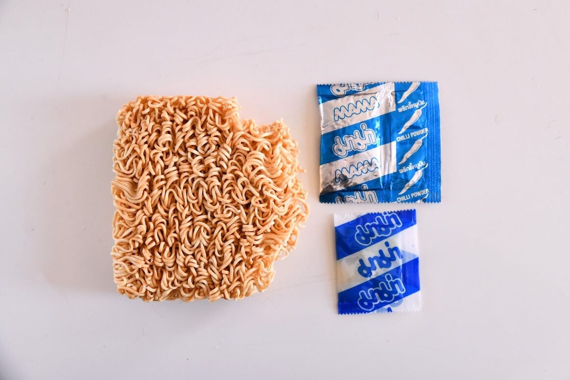 Noodle brick, seasoning packet, and seasoning paste packet.