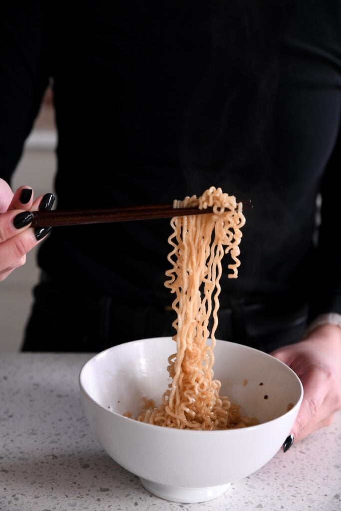 Noodle pull with chopsticks
