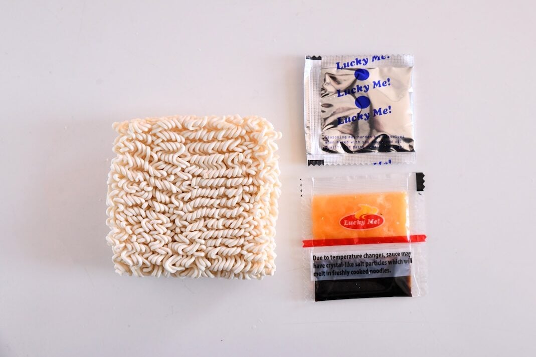Noodle brick, oil package, sauce package, seasoning packet