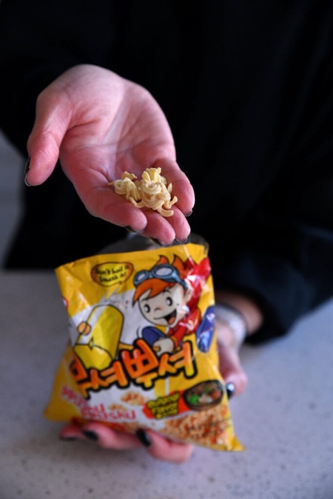 Crushed noodles in hand