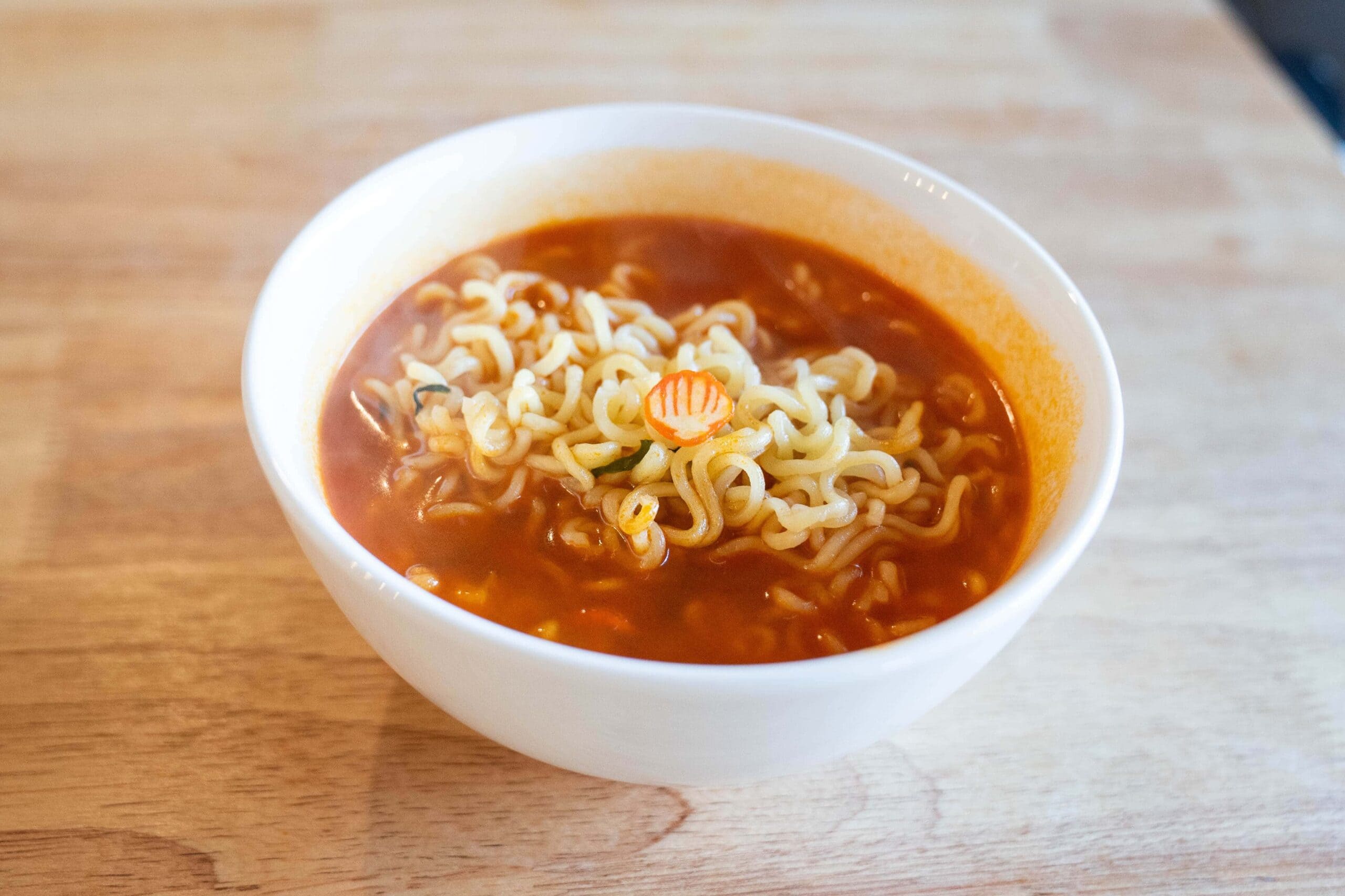 Cooked noodles and broth in bowl