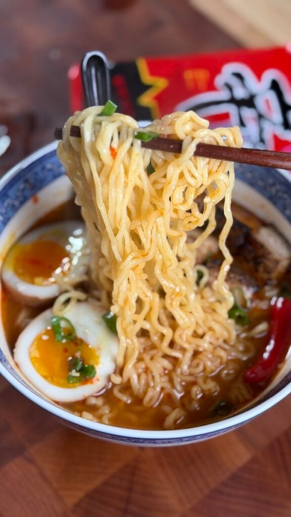 noodle pull from bowl of noodles