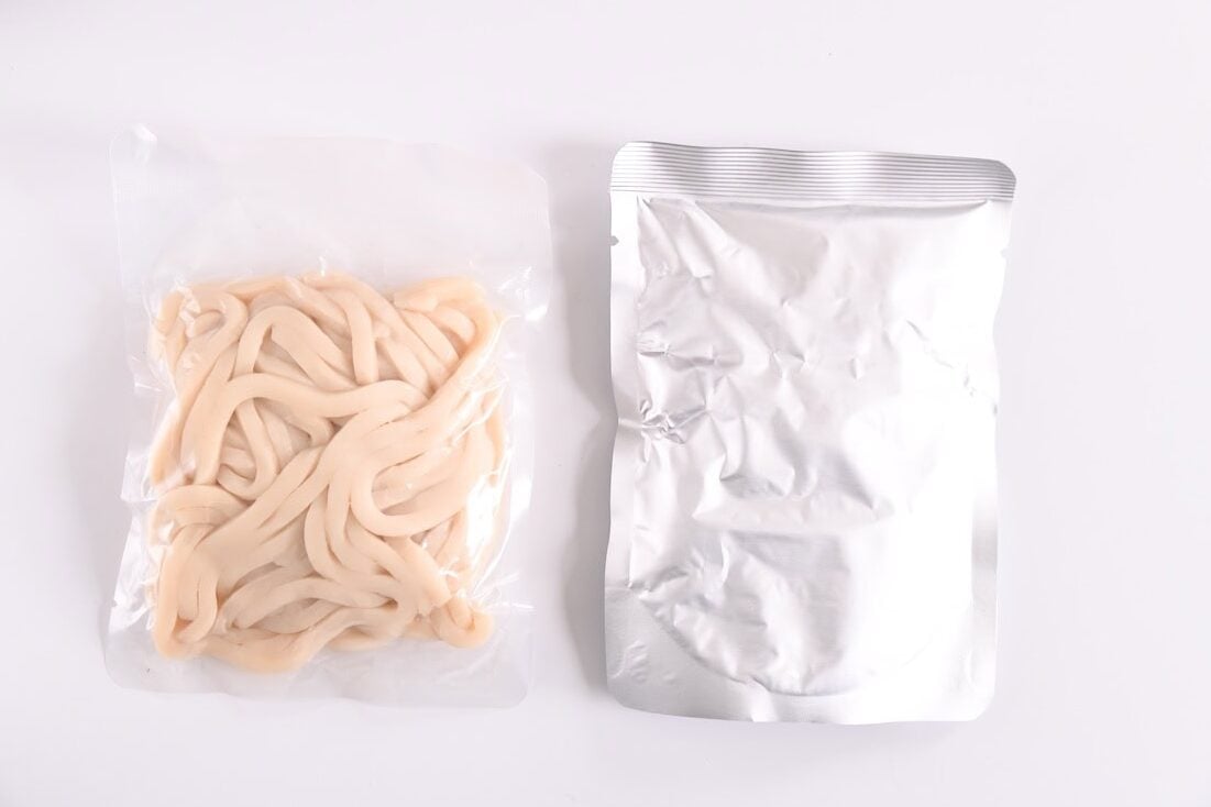 Noodles and larger seasoning package