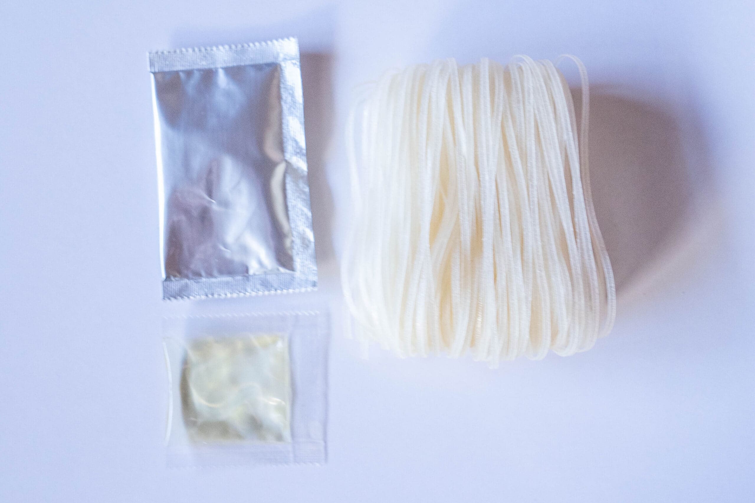 Soup base, oil packet, and uncooked noodles