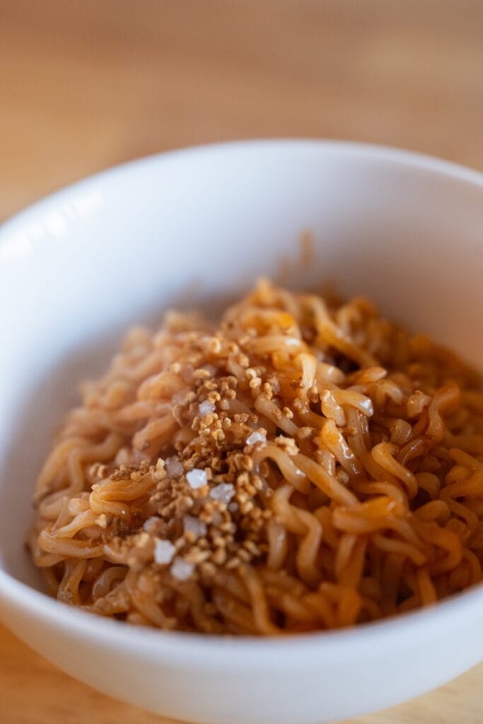 Samyang Buldak SWICY Sweet & Spicy Ramen prepared in a white bowl with no broth
