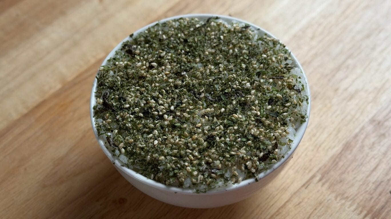 Finished Shin Ramyun rice bowl topped with furikake, viewed from above