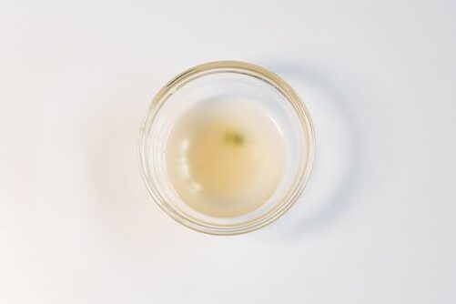 Small glass ramekin of the Heal Spot High Protein Instant Ramen Classic Ramen Flavor broth