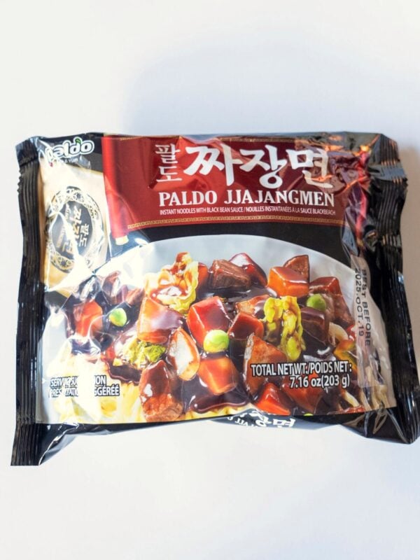 The black package of Paldo Jjajangmen on a white surface