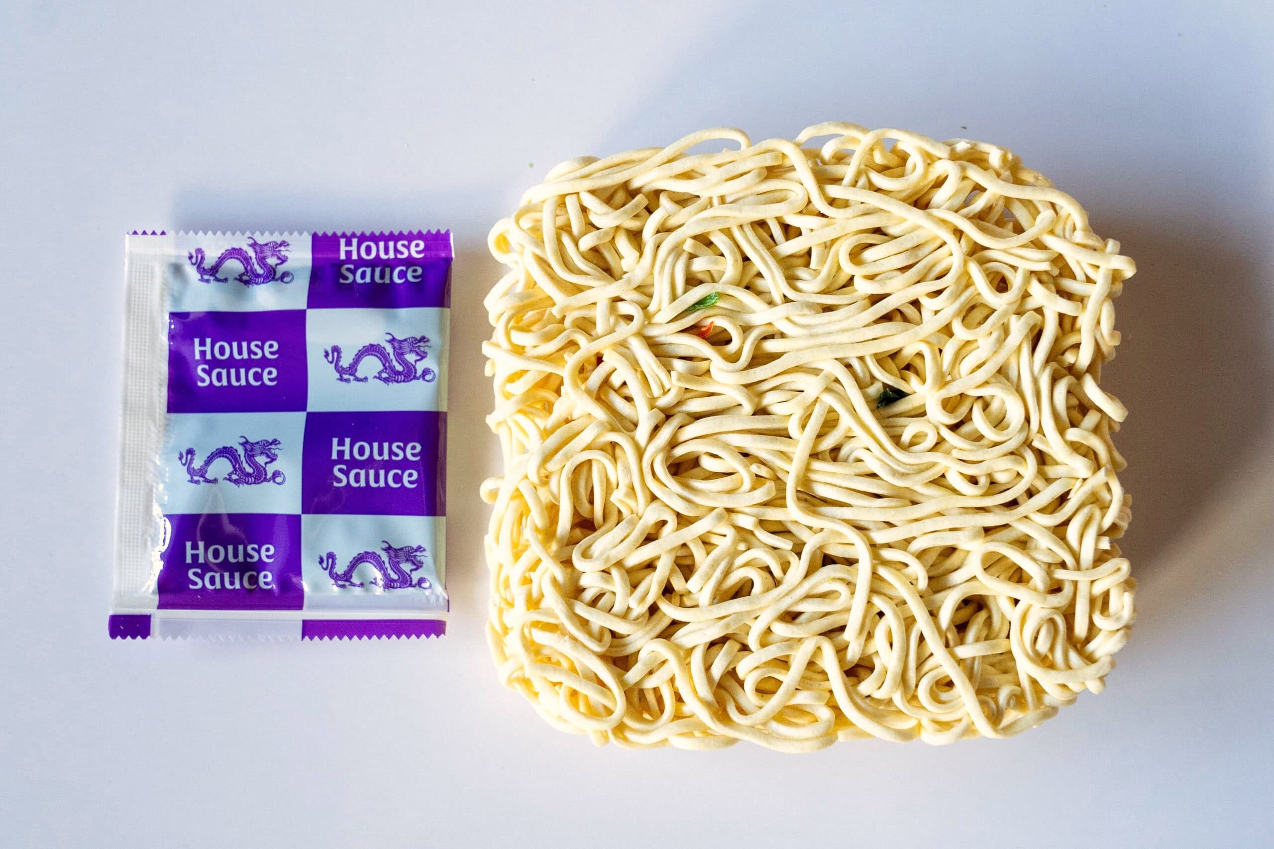 House sauce packet and square noodle brick
