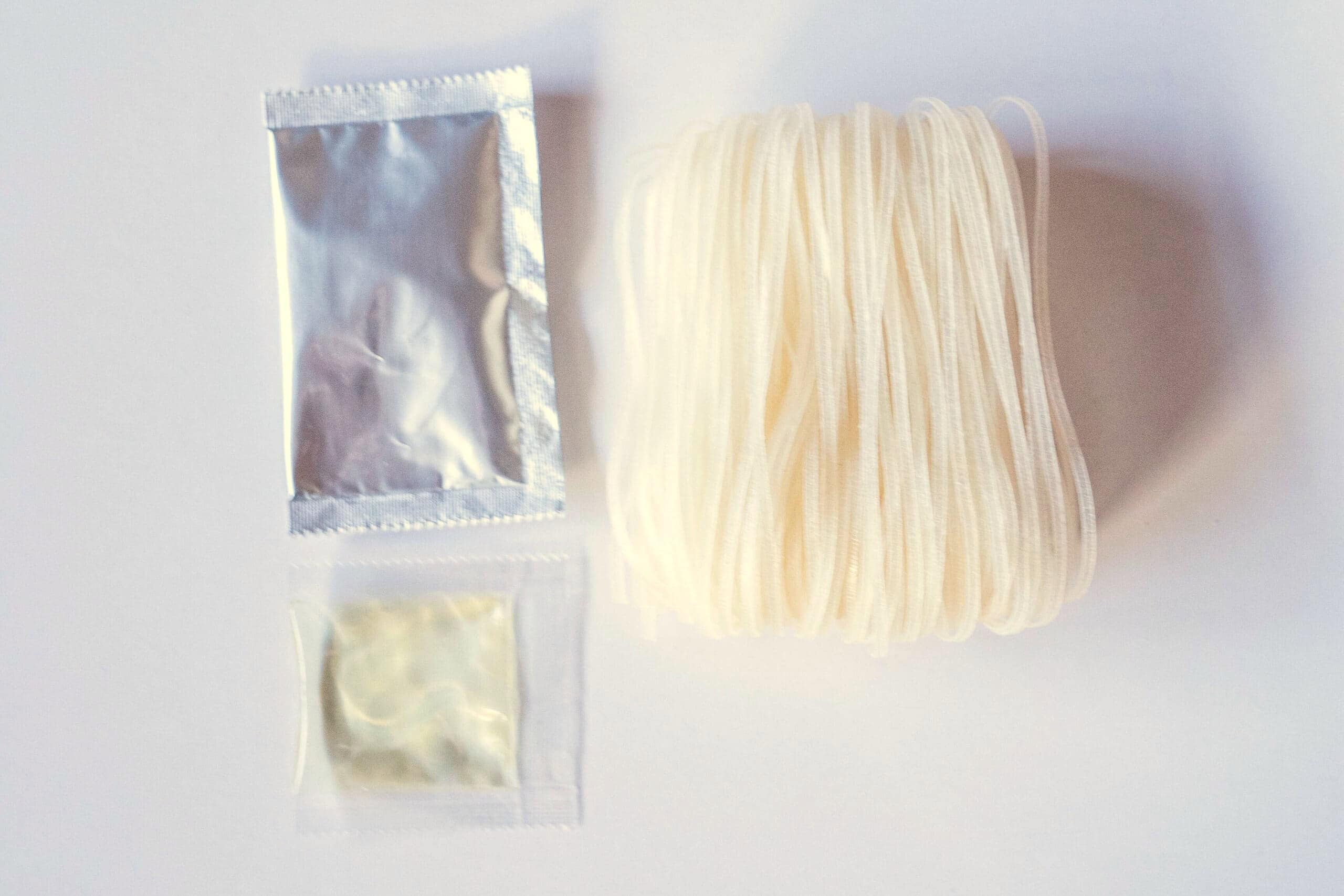 Soup base, oil packet, and uncooked noodles