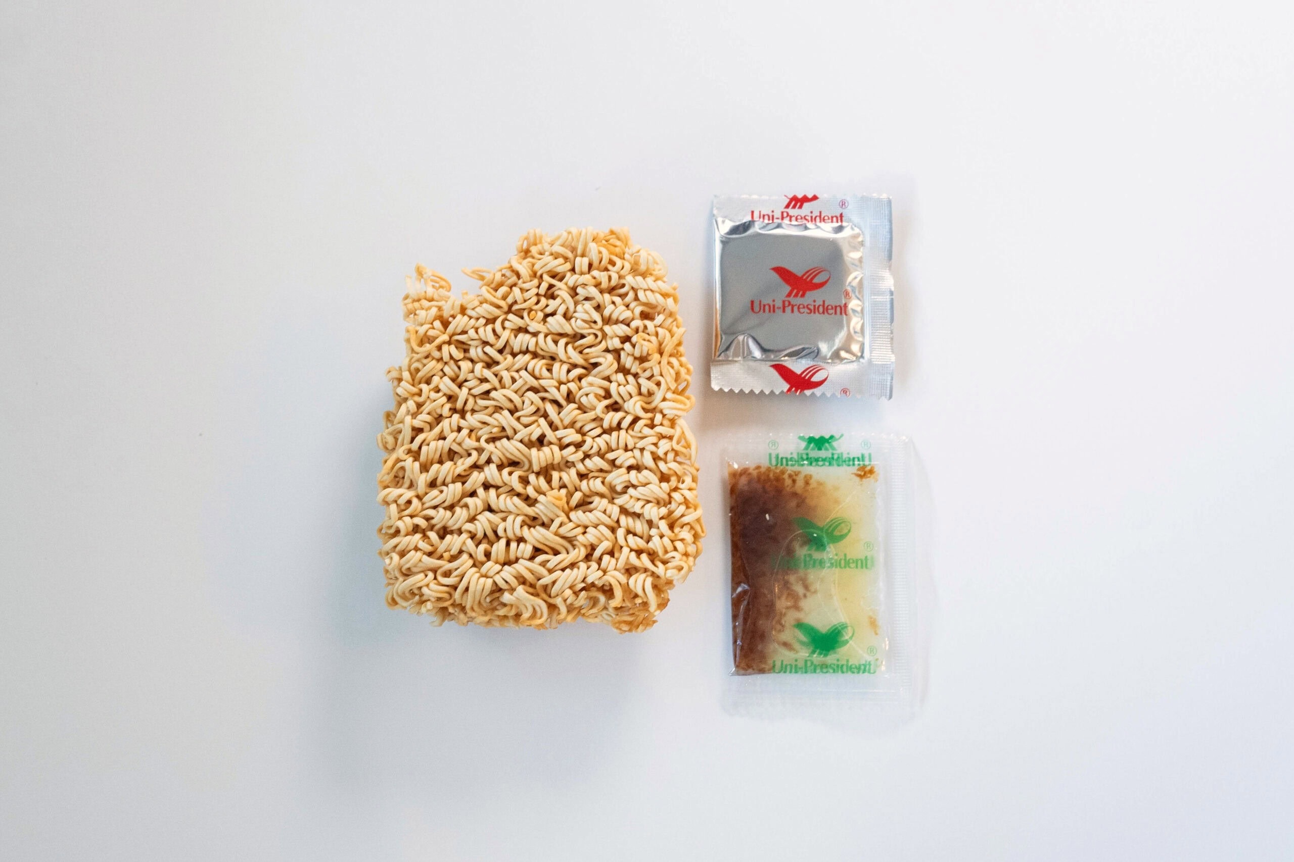 Square noodle brick, seasoning packet, and oil packet.