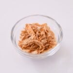 glass ramekin containing fried onion