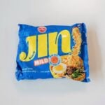The front of the Ottogi Jin Ramen Mild with Beef Bone Broth package on a white surface, showing a bright blue foil pouch with a large yellow "Jin Ramen" logo, a red "MILD" badge, a "MADE WITH BEEF BONE BROTH" callout, and a serving-suggestion photo of the ramen with a halved egg, beef, mushrooms, and greens. Net Wt. 4.23 oz (120g)